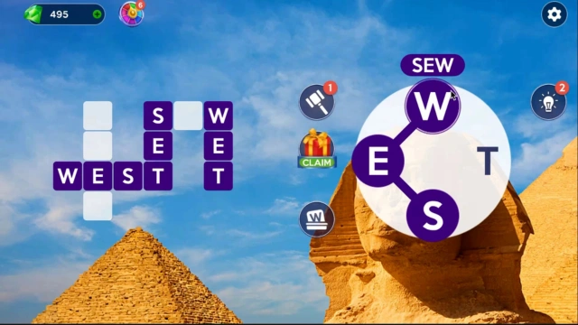 Spelling SEW on the letter wheel while WEST and WET sit completed in the crossword grid