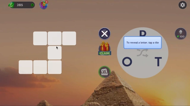 Tutorial tip explaining that tapping a tile reveals a letter, shown beside an empty crossword grid